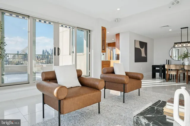 a bathroom with a granite countertop sink mirror and shower