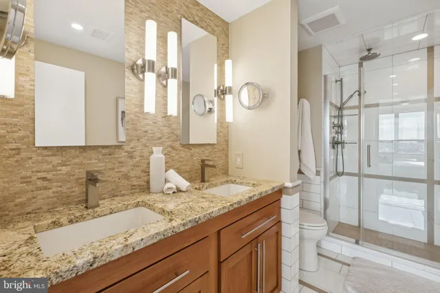 a large white kitchen with a large window