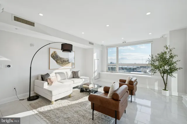 a kitchen with stainless steel appliances white cabinets and a sink