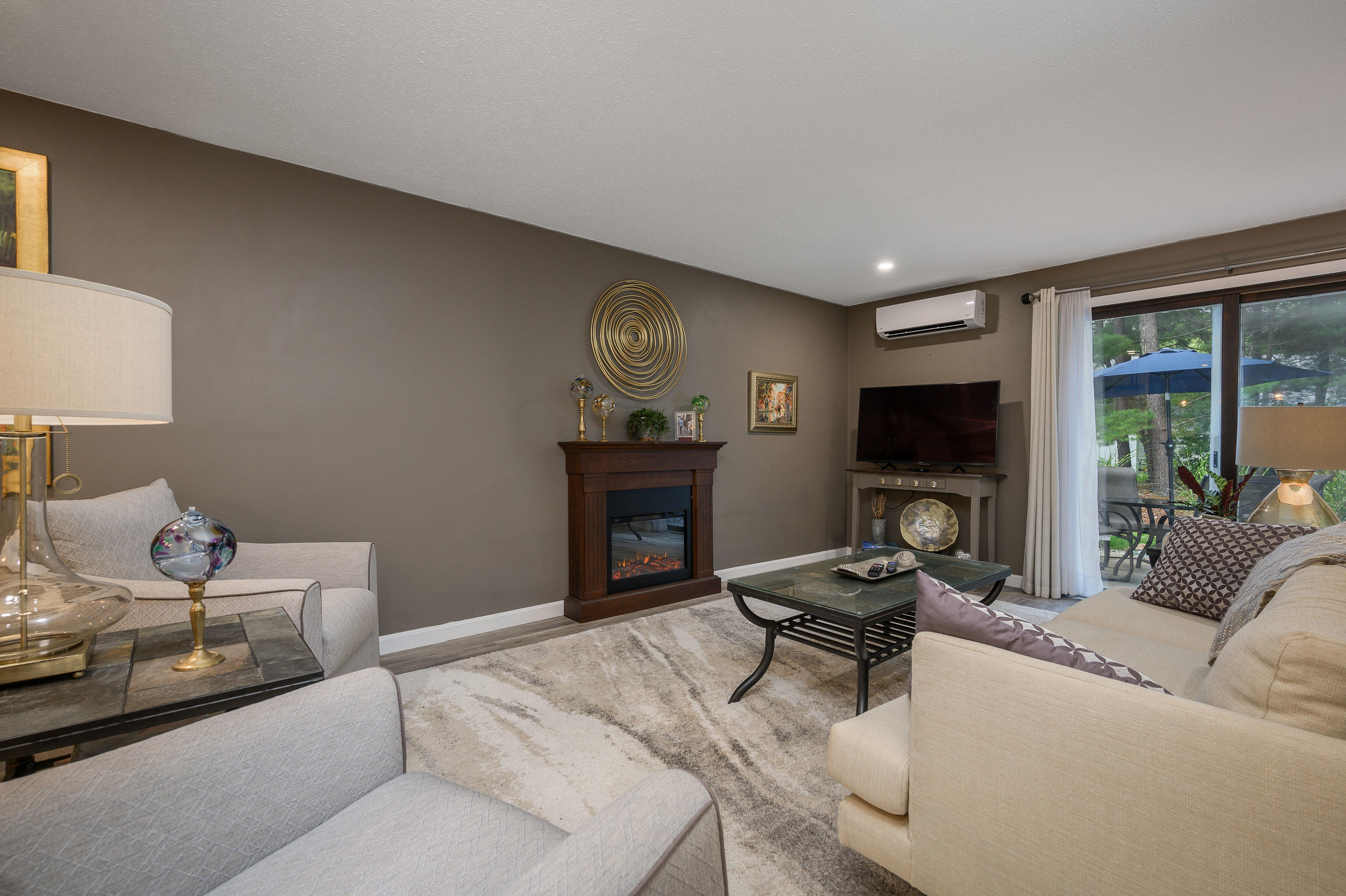 174 Lowell Road, Unit D39 Mashpee, MA 02649 - Photo 14 of 32 a living room with furniture and a flat screen tv