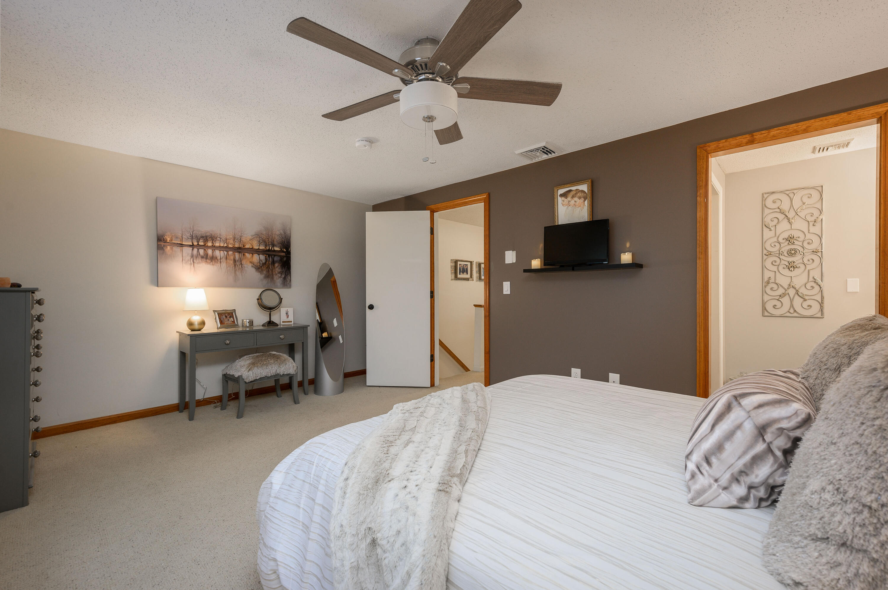 174 Lowell Road, Unit D39 Mashpee, MA 02649 - Photo 19 of 32 a bedroom with a bed large window and couch