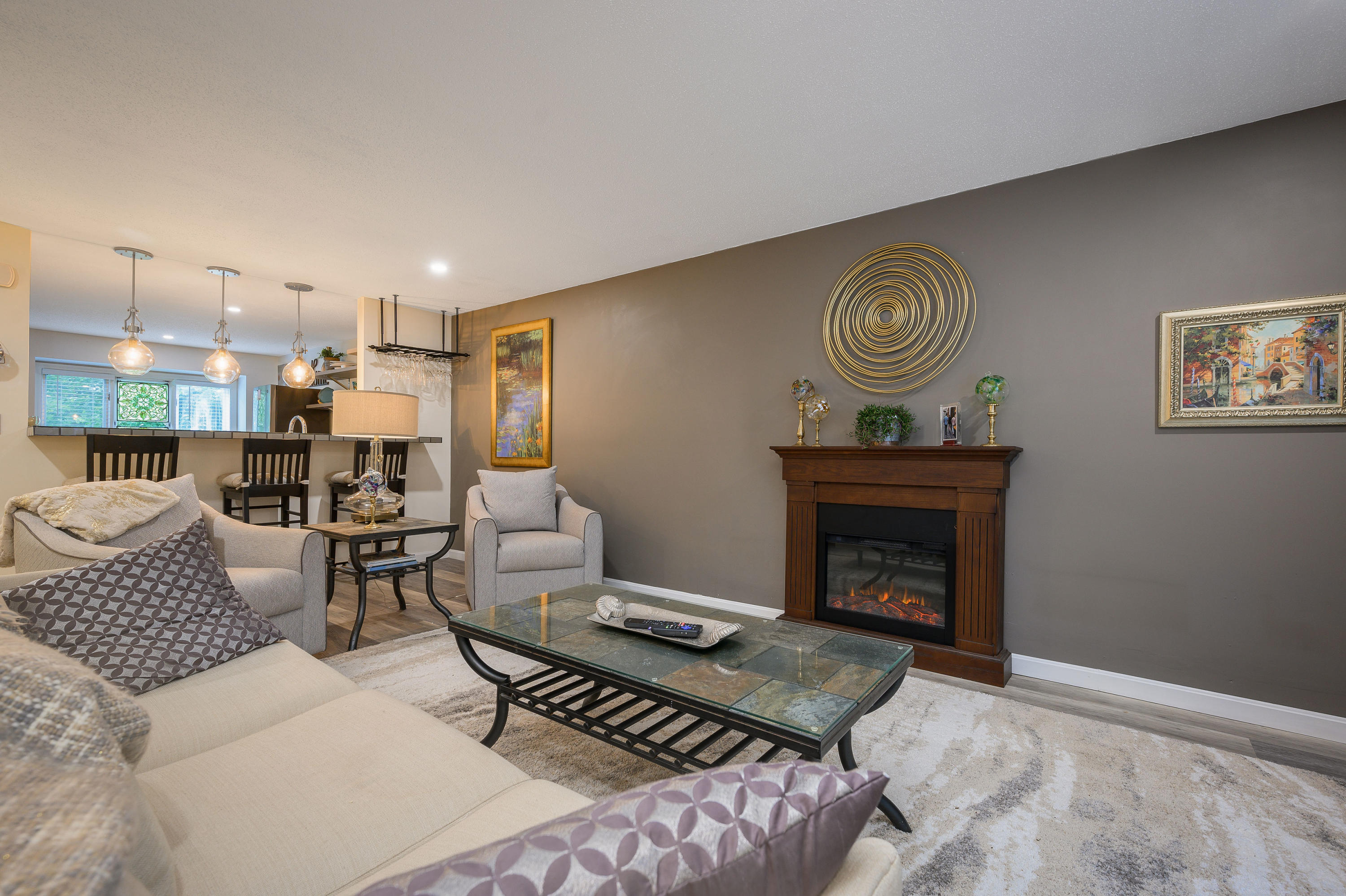 174 Lowell Road, Unit D39 Mashpee, MA 02649 - Photo 5 of 32 a living room with furniture and a fireplace