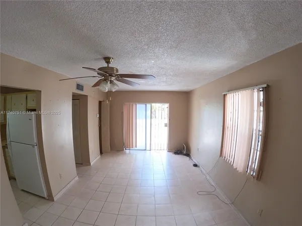 a view of livingroom with hardwood floor and a ceiling fan