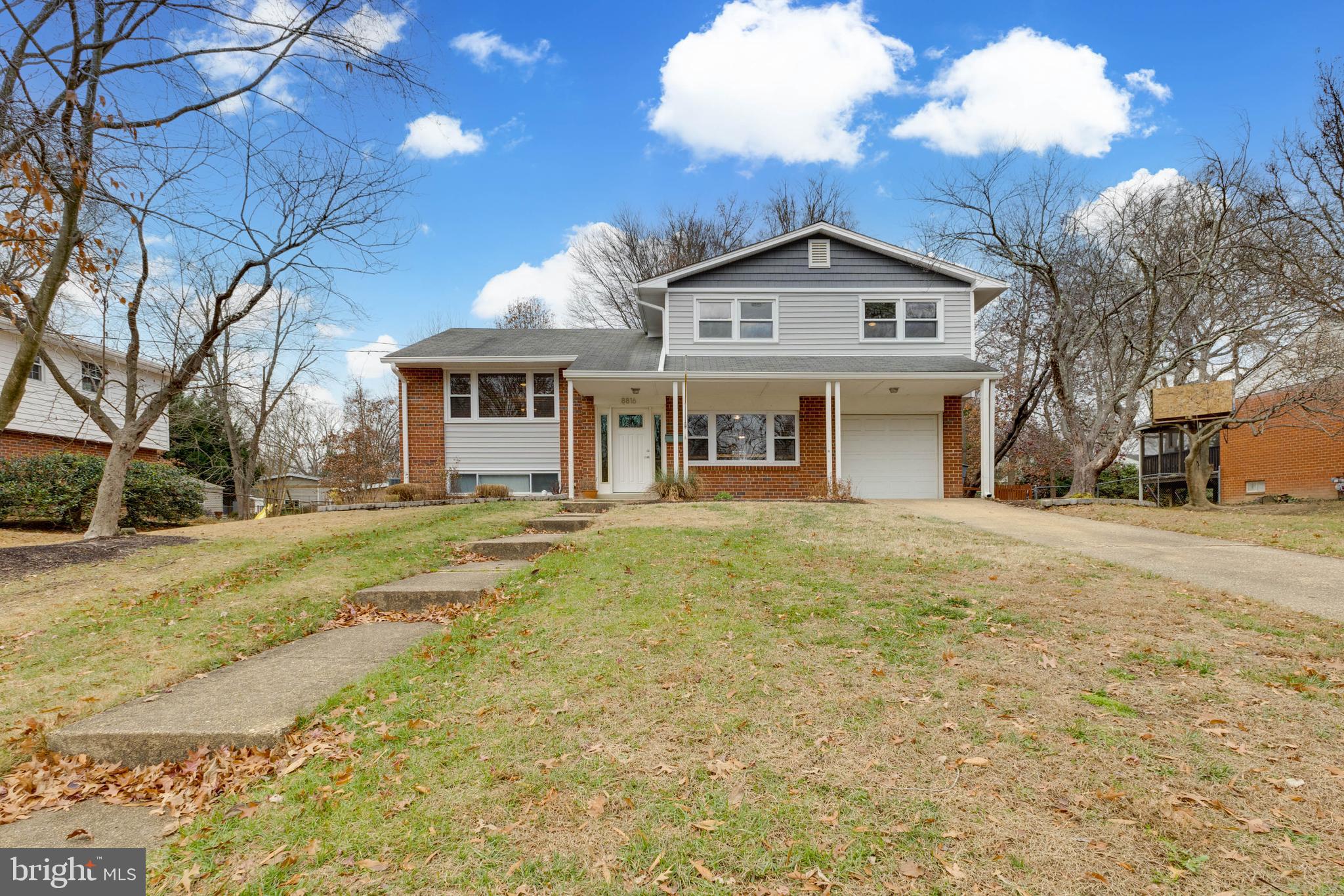a view of a house with a yard