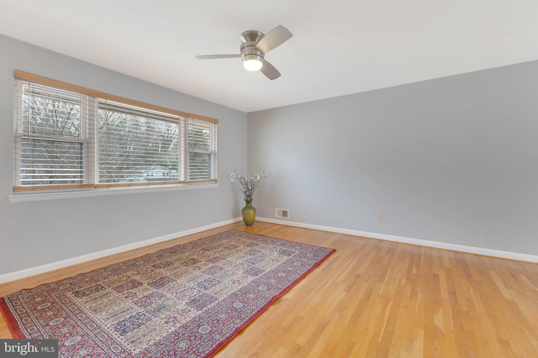 8816 Battery Road Alexandria, VA 22308 - Photo 14 of 25 a view of an empty room with a window and wooden floor