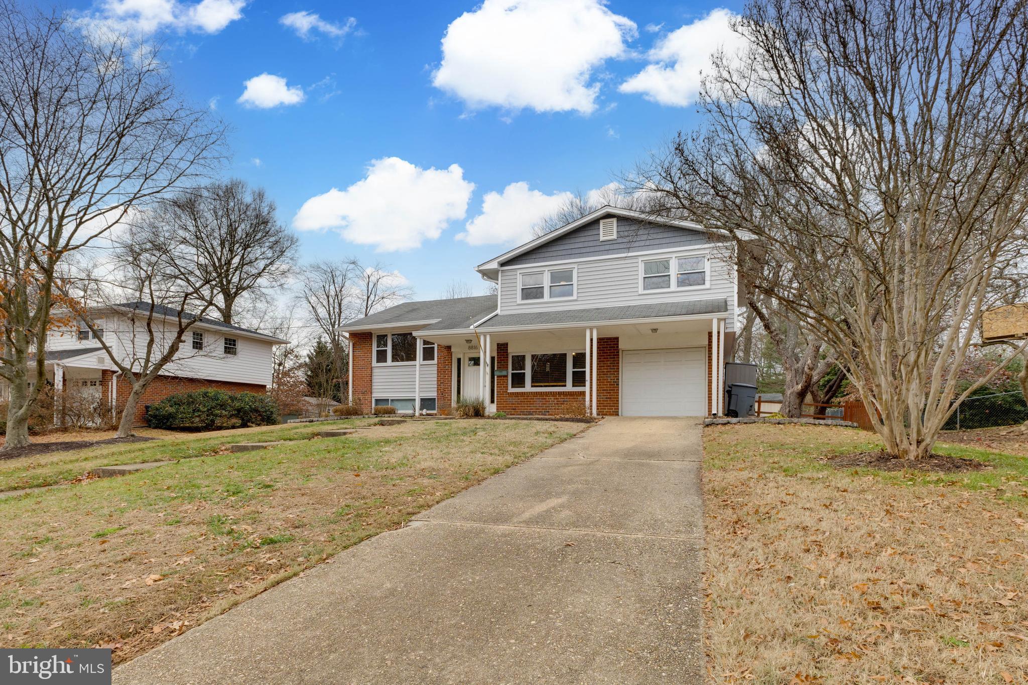 8816 Battery Road Alexandria, VA 22308 - Photo 2 of 25 a front view of a house with a yard