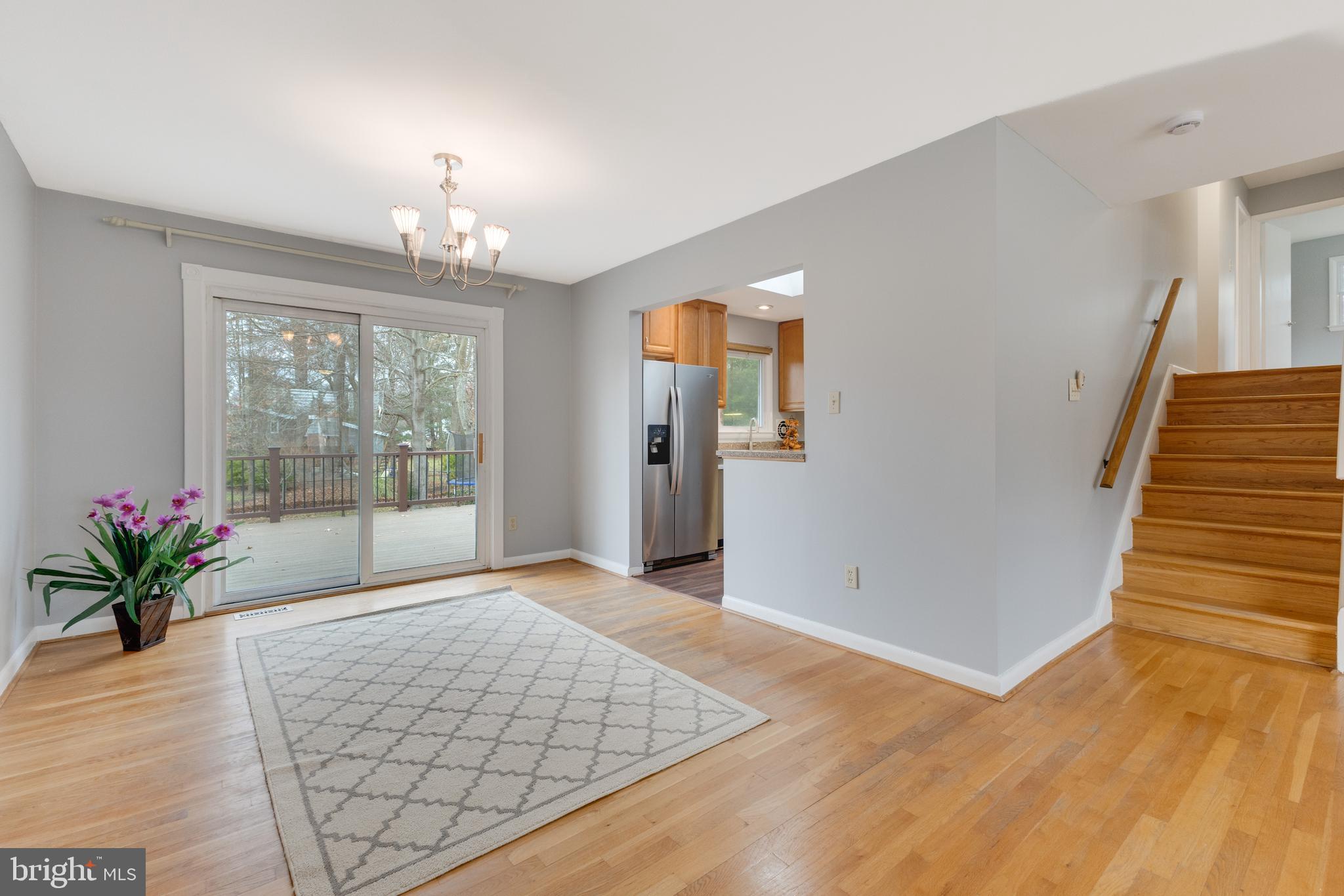 8816 Battery Road Alexandria, VA 22308 - Photo 9 of 25 a view of an empty room with wooden floor and a window