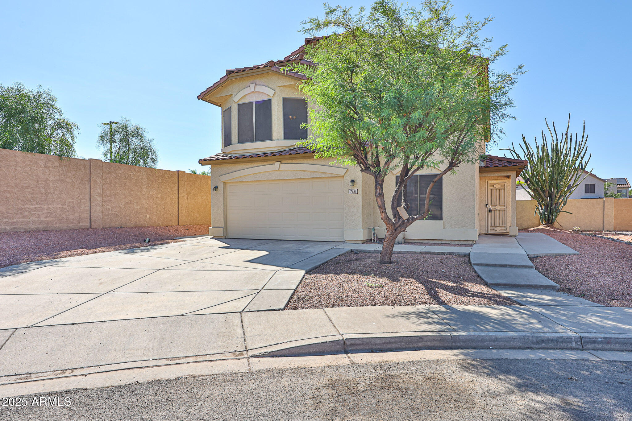 a front view of a house with garage