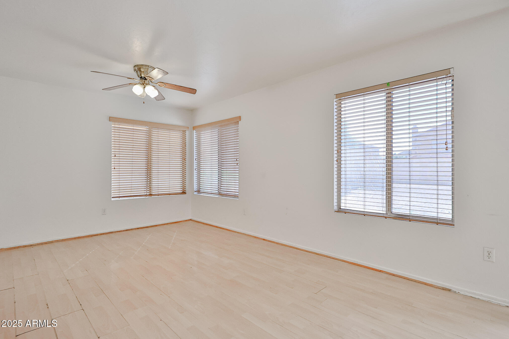 7681 West Lamar Road Glendale, AZ 85303 - Photo 12 of 36 a view of an empty room with a window