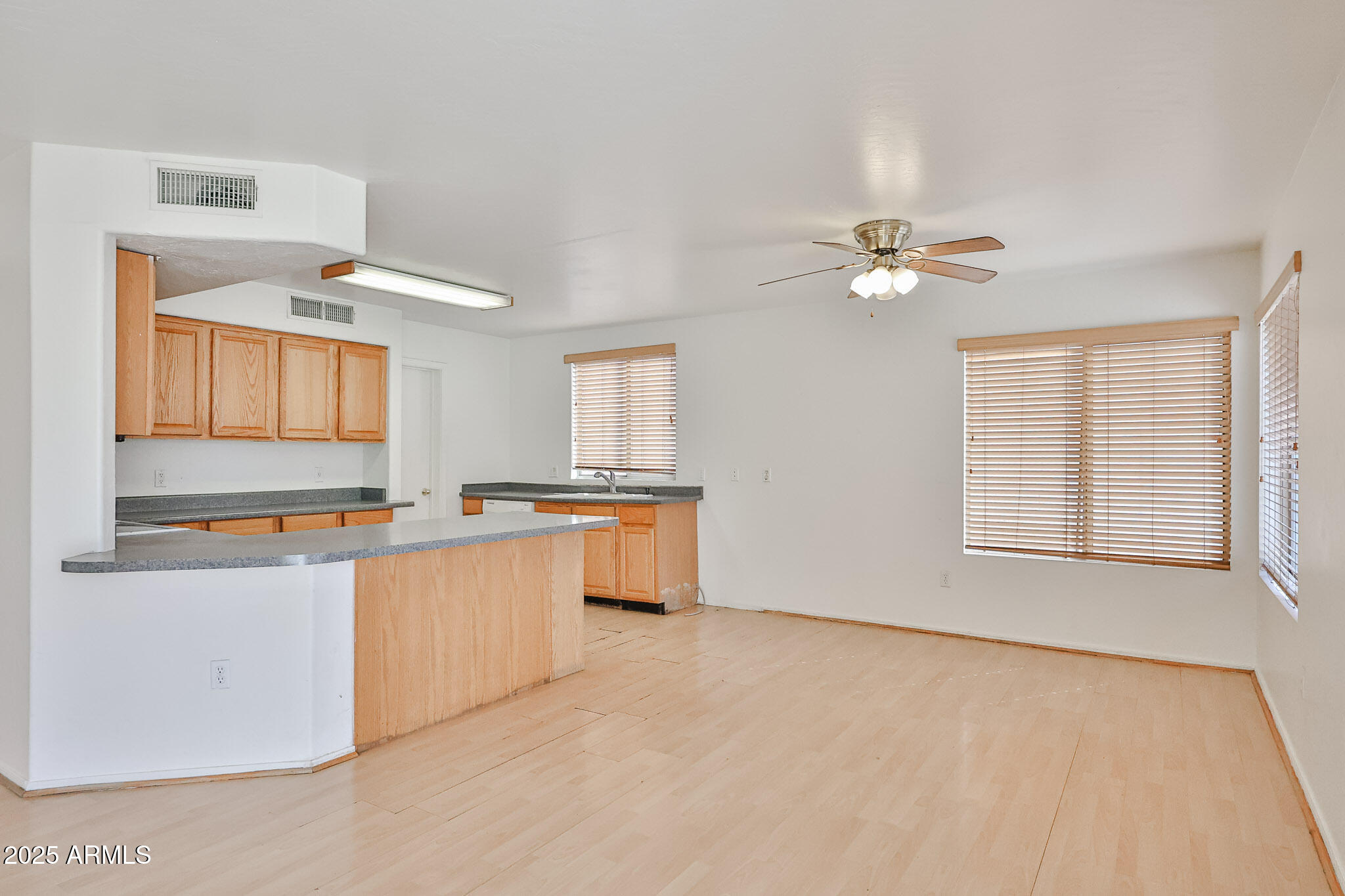 7681 West Lamar Road Glendale, AZ 85303 - Photo 13 of 36 a view of a kitchen with microwave and cabinets