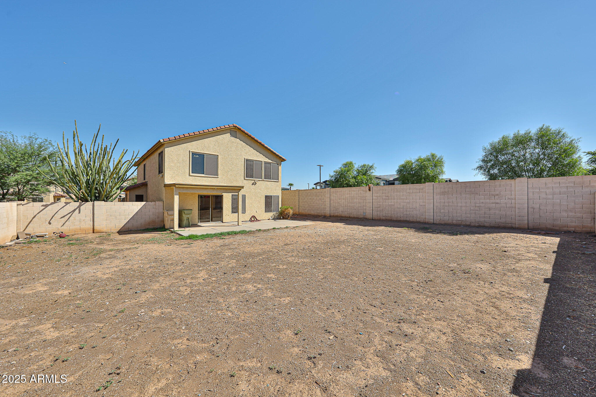 7681 West Lamar Road Glendale, AZ 85303 - Photo 36 of 36 a front view of a house with a yard and garage