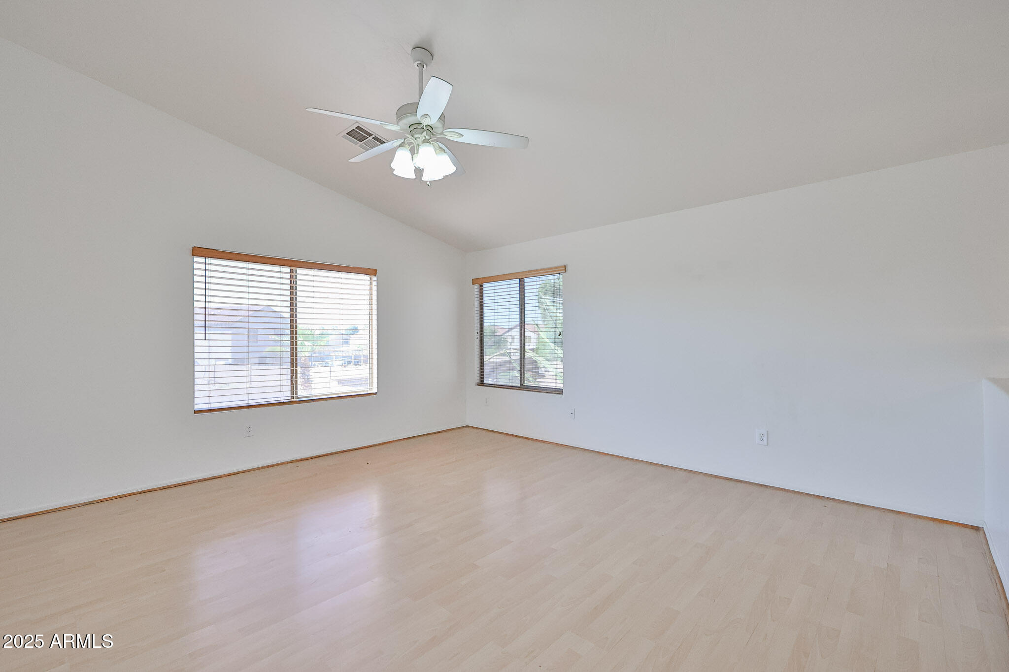 7681 West Lamar Road Glendale, AZ 85303 - Photo 5 of 36 a view of an empty room with a window