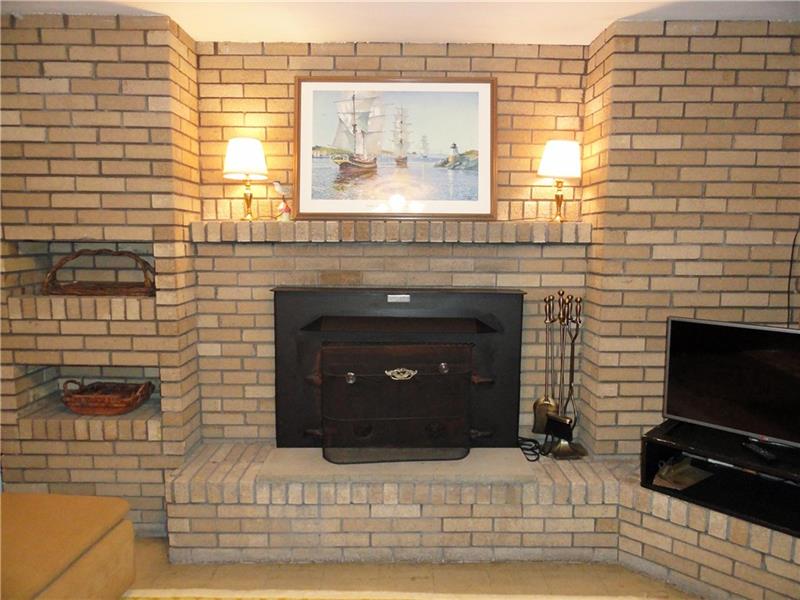 938 Peairs Road Elizabeth, PA 15037 - Photo 14 of 25 Lower level brick fireplace with wood burner