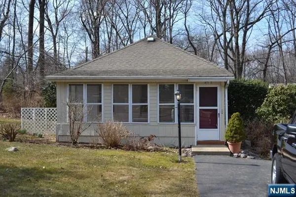 a house with trees in the background