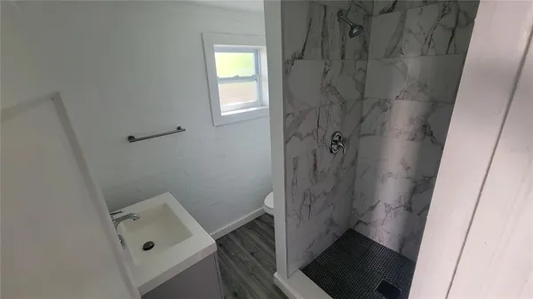 a bathroom with a tub and sink