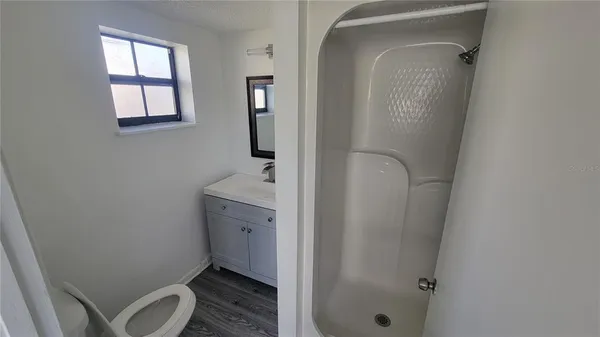 a bathroom with a toilet and a sink