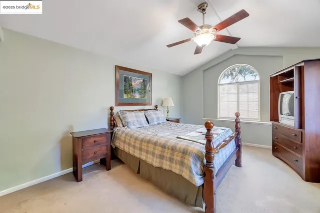 a bed room with a bed and a large window