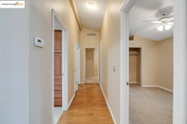 a view of a hallway with a white walls