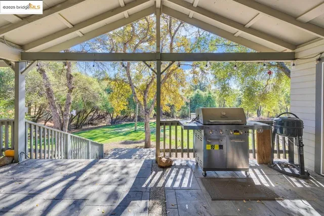 a view of a deck with wooden floor and outdoor space