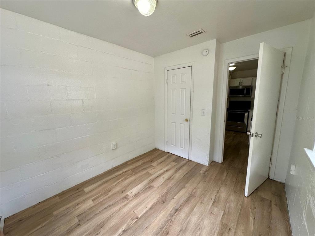 647 Northeast Waldo Road Gainesville, FL 32641 - Photo 15 of 25 wooden floor in an empty room