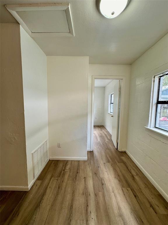647 Northeast Waldo Road Gainesville, FL 32641 - Photo 16 of 25 a view of hallway with wooden floor