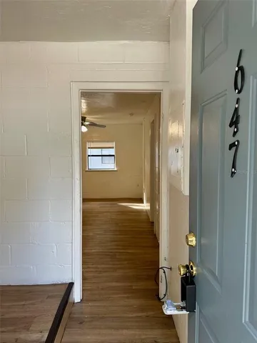 a view of a storage & utility room with wooden floor