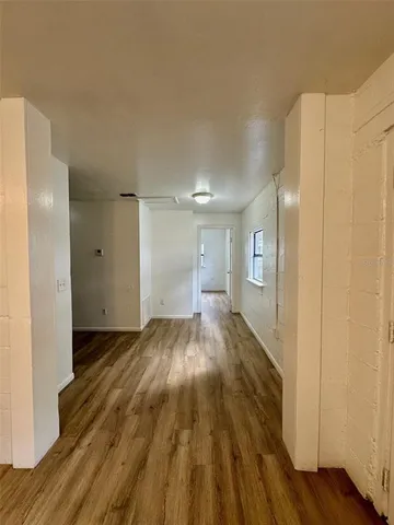 a kitchen with stainless steel appliances granite countertop a refrigerator a stove a sink and a microwave