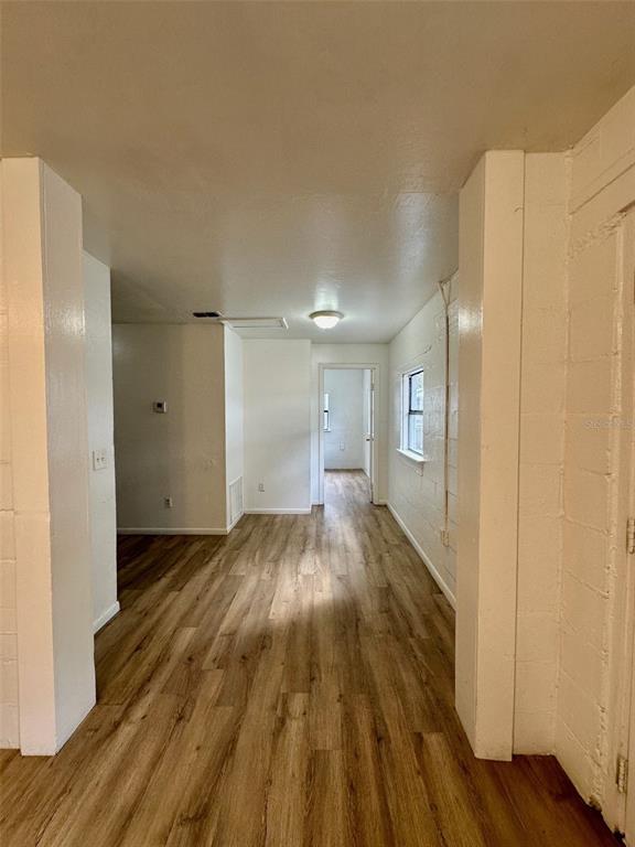 647 Northeast Waldo Road Gainesville, FL 32641 - Photo 8 of 25 a view of an empty room and wooden floor