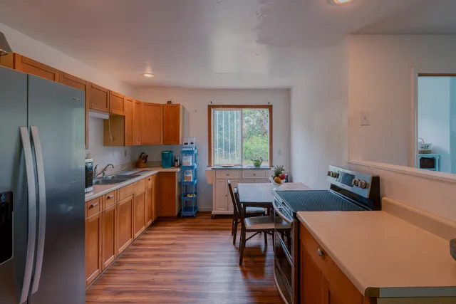 a bathroom with a toilet sink and a window