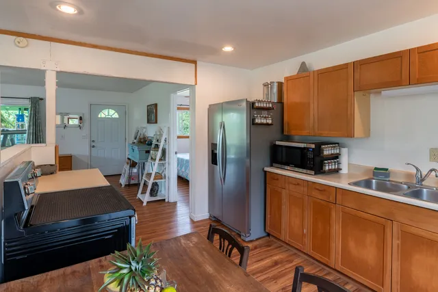 a view of a livingroom with furniture and hardwood floor