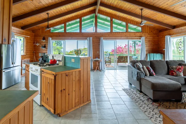 a kitchen with furniture and a stove
