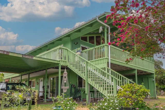 a view of a car park in front of house