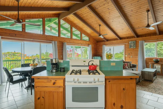 a view of kitchen with furniture and large windows