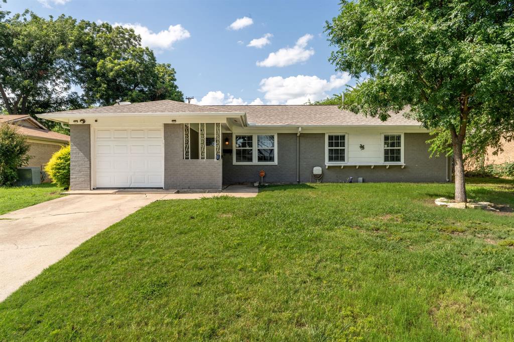 8820 Guadalupe Road Fort Worth, TX 76116 - Photo 1 of 1 Ranch-style home with driveway, a front yard, brick siding, roof with shingles, and a garage