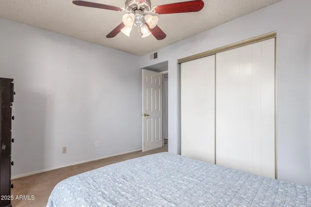 a view of room with a ceiling fan