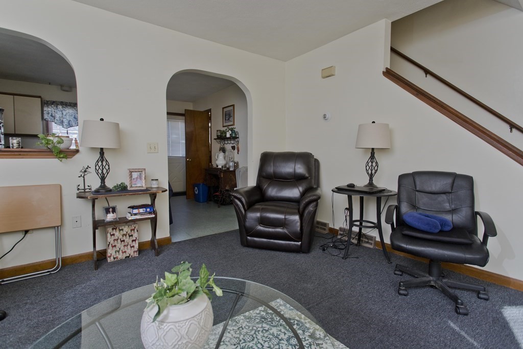 20-22 Gold Street Springfield, MA 01107 - Photo 14 of 27 a living room with furniture and a chair