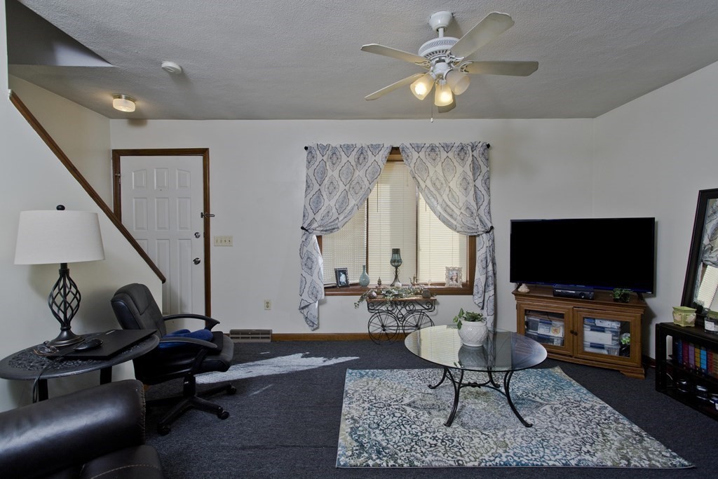 20-22 Gold Street Springfield, MA 01107 - Photo 15 of 27 a living room with furniture and a flat screen tv