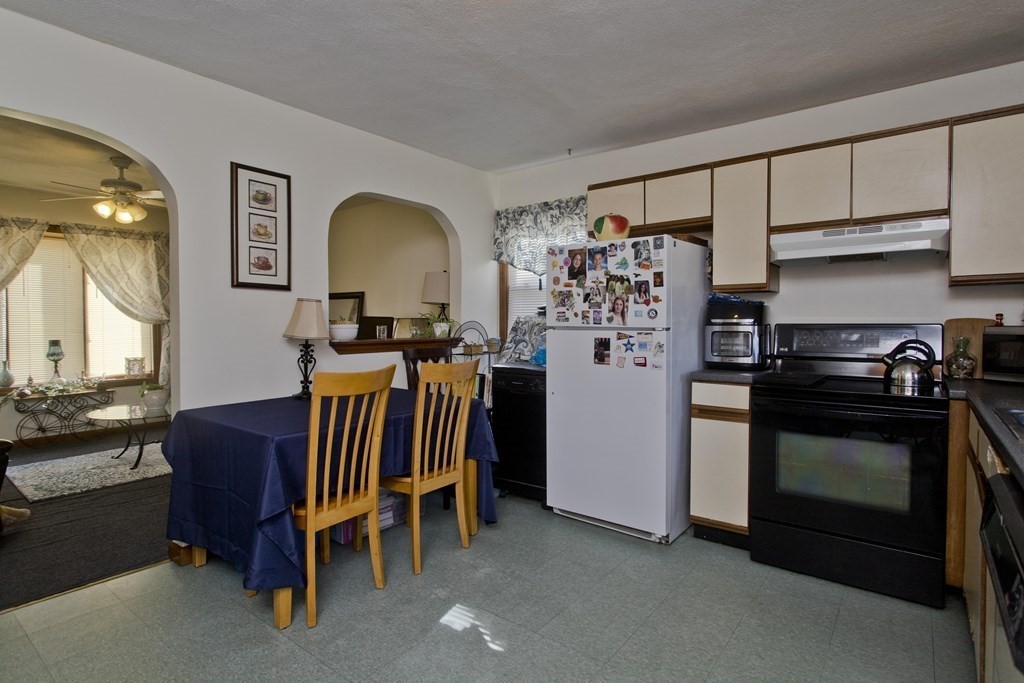 20-22 Gold Street Springfield, MA 01107 - Photo 17 of 27 a view of kitchen with stainless steel appliances granite countertop stove top oven and cabinets