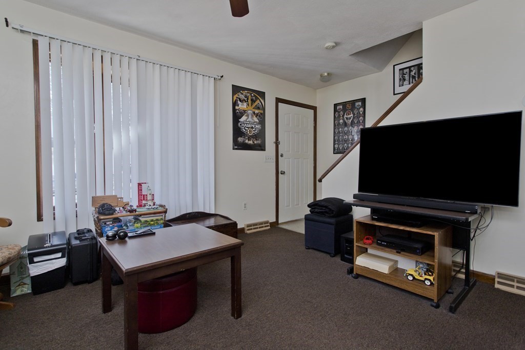 20-22 Gold Street Springfield, MA 01107 - Photo 19 of 27 a living room with furniture and a flat screen tv