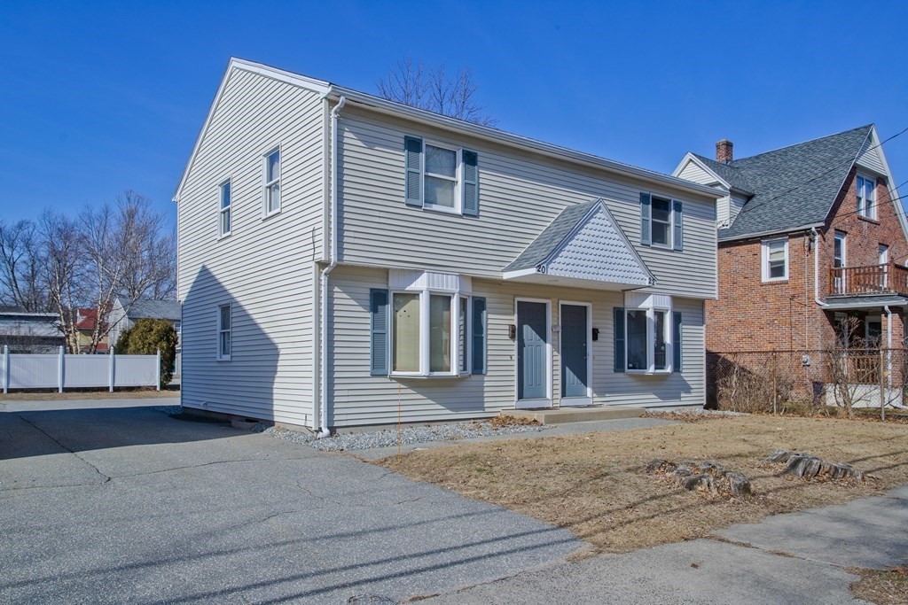 20-22 Gold Street Springfield, MA 01107 - Photo 2 of 27 a front view of a house with a yard