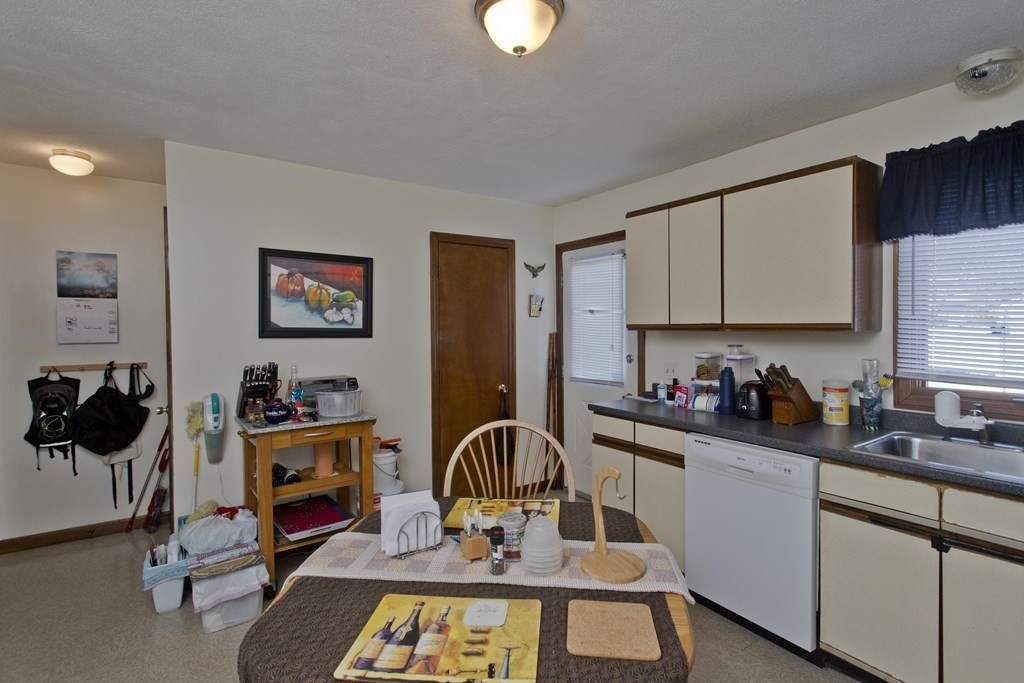 20-22 Gold Street Springfield, MA 01107 - Photo 24 of 27 a kitchen with a appliances a stove and cabinets