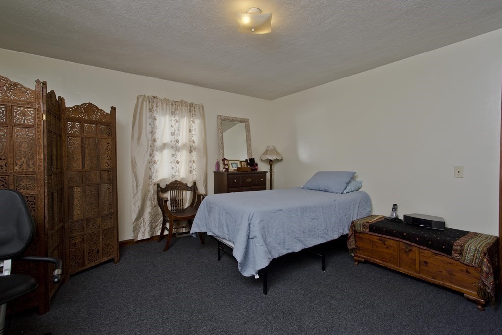 20-22 Gold Street Springfield, MA 01107 - Photo 8 of 27 a bedroom with bed and window