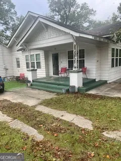 a front view of a house with garden
