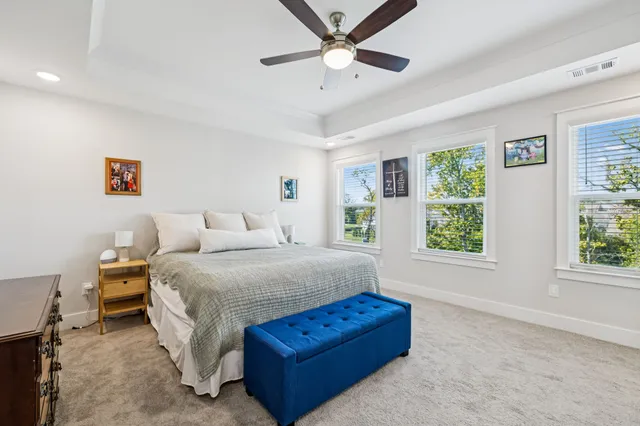 a bedroom with a bed window and couch