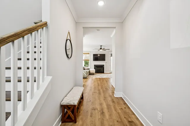 a view of a room with wooden floor and staircase