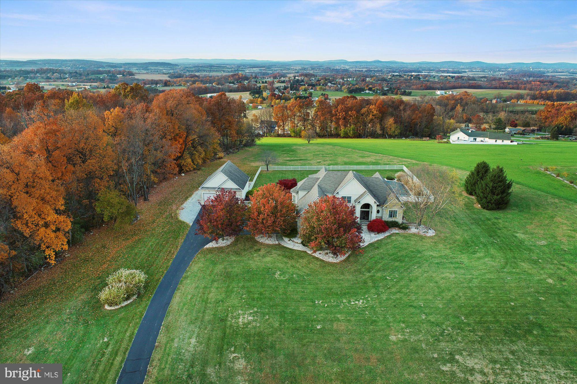 4549 Walters Hatchery Road Spring Grove, PA 17362 - Photo 2 of 64 an aerial view of a house with a garden and lake view