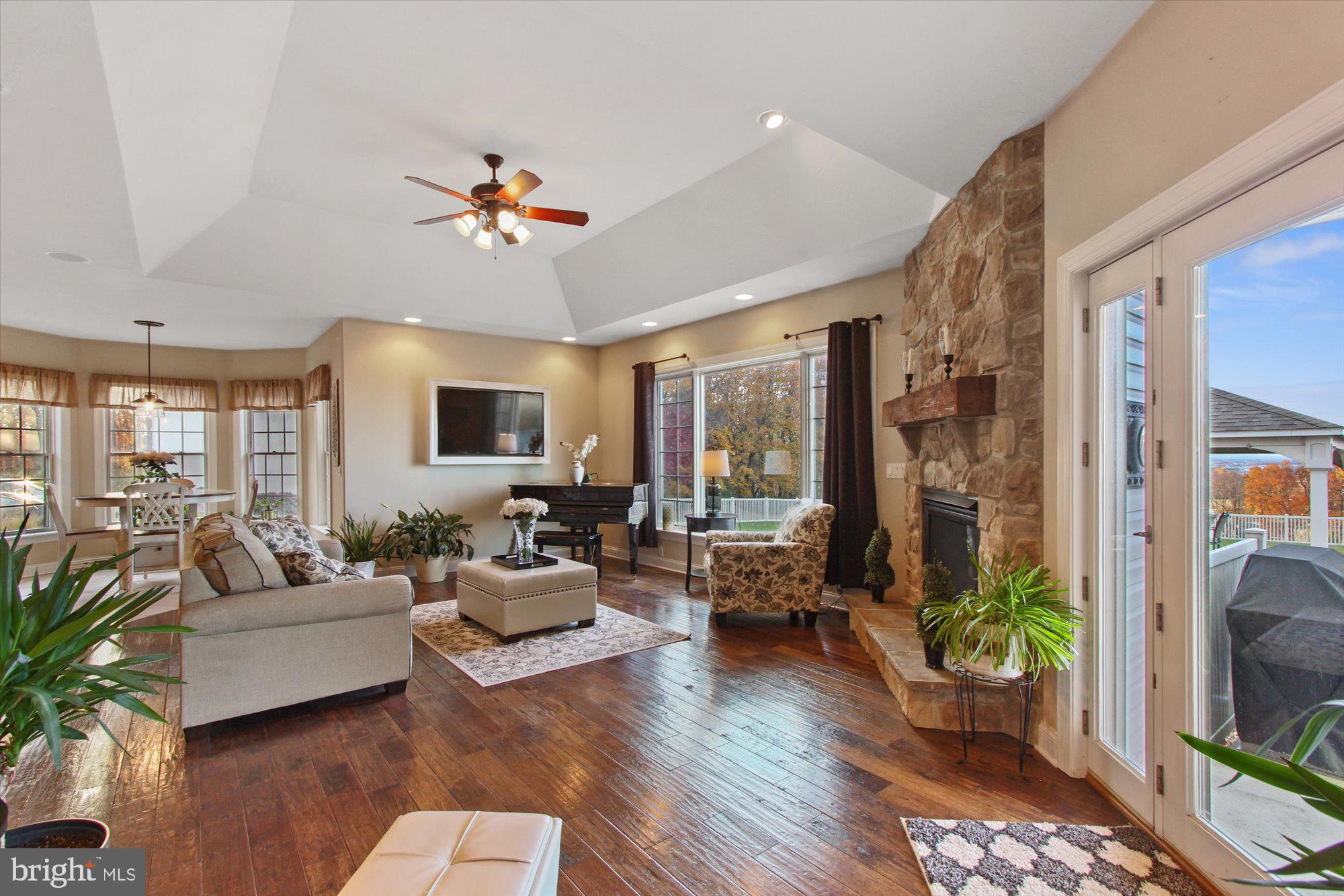 4549 Walters Hatchery Road Spring Grove, PA 17362 - Photo 16 of 64 a living room with patio furniture and a chandelier