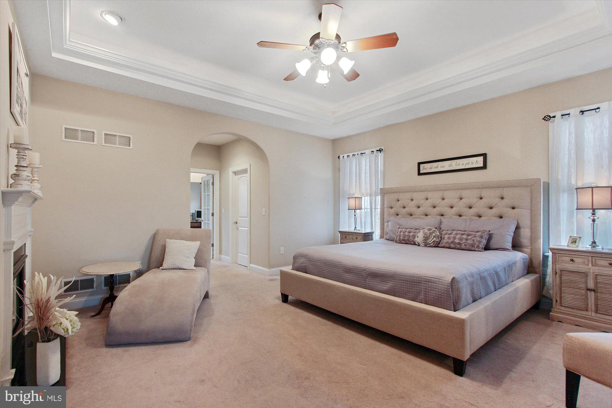 4549 Walters Hatchery Road Spring Grove, PA 17362 - Photo 20 of 64 a bedroom with a large bed and a chandelier