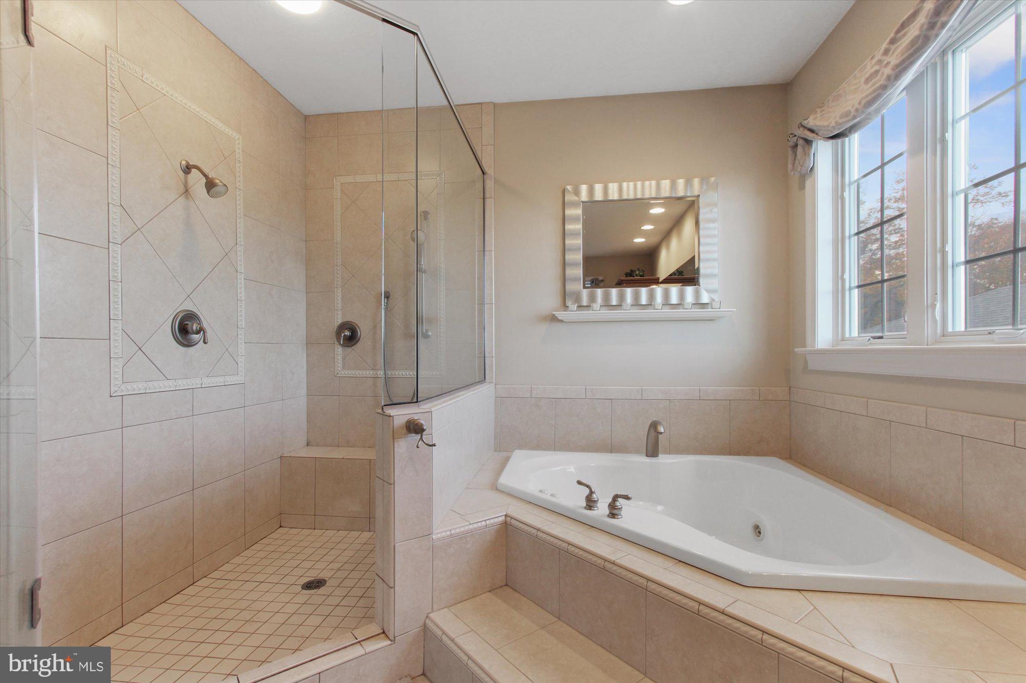 4549 Walters Hatchery Road Spring Grove, PA 17362 - Photo 24 of 64 a bathroom with a tub a toilet and a shower