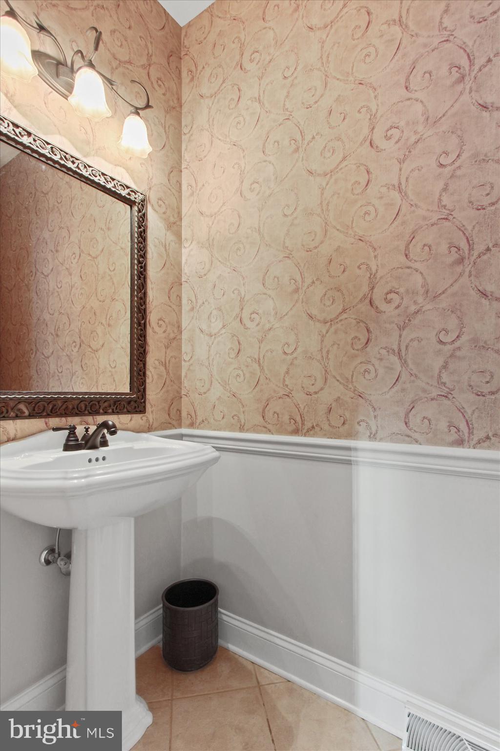 4549 Walters Hatchery Road Spring Grove, PA 17362 - Photo 26 of 64 a bathroom with a sink and a mirror